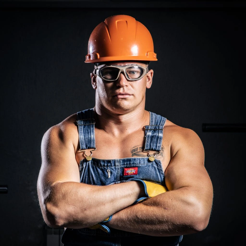 Close-up of an electrician working on a substation switchgear panel